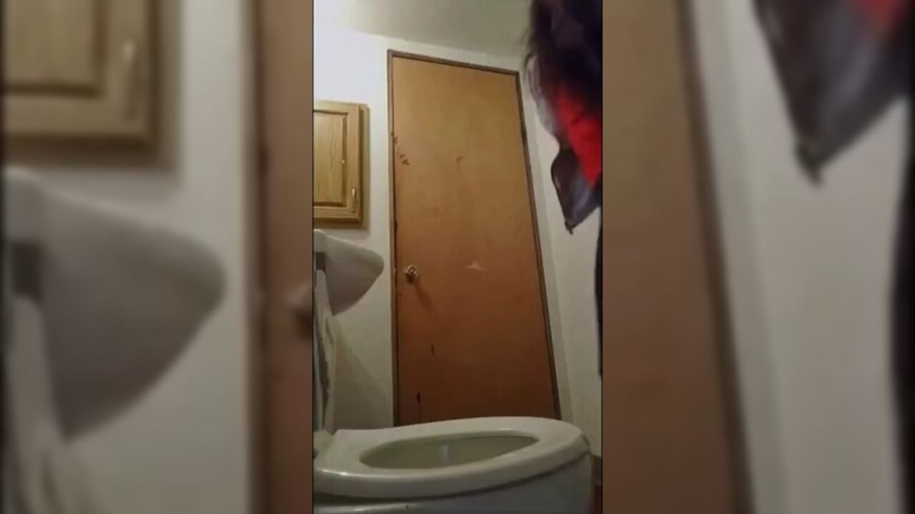 Watch this cute girl get a golden shower while pooping in her toilet
