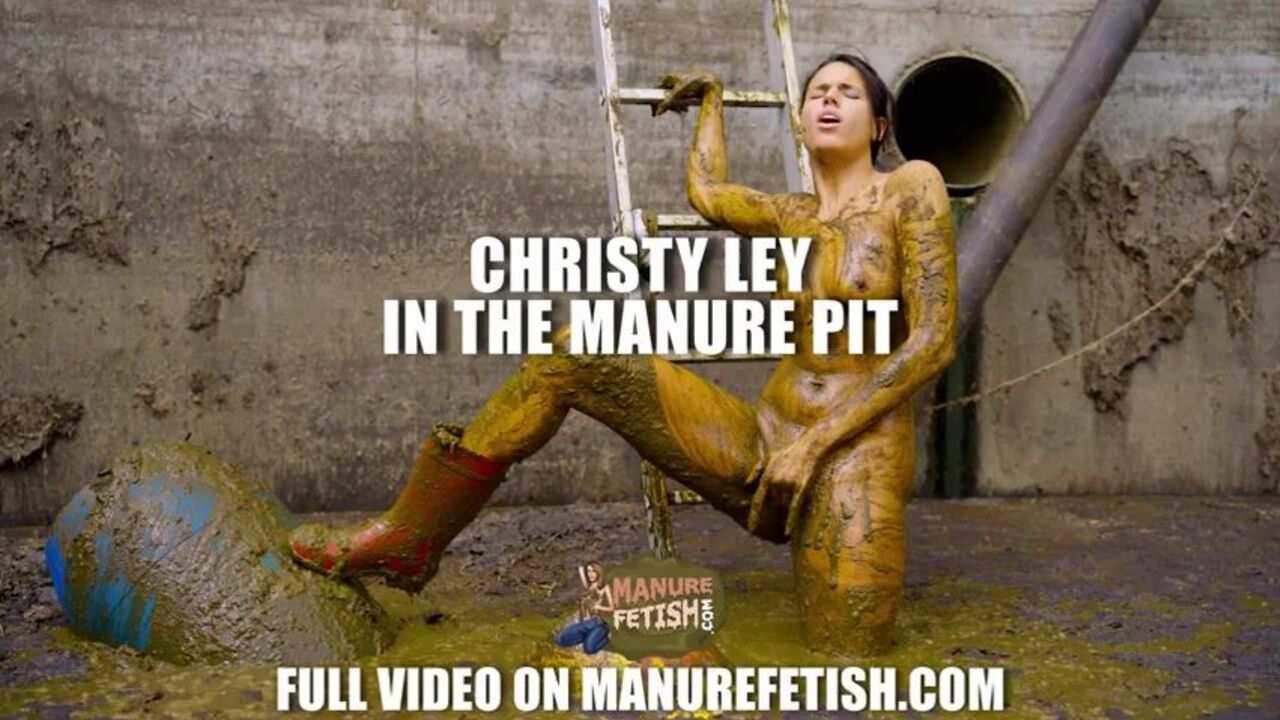 Christy Ley gets a taste of dung in the manure hole