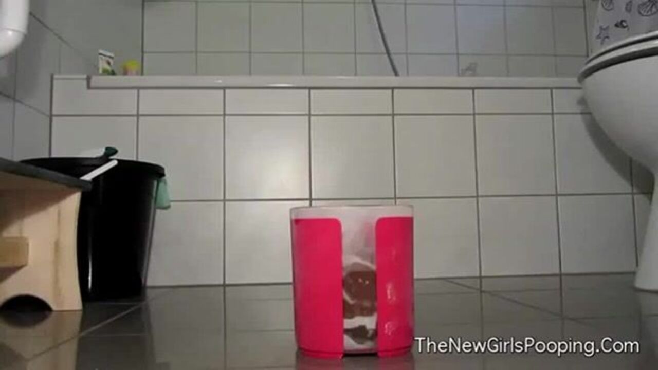 Watch this filthy slut get a messy surprise in her scat box