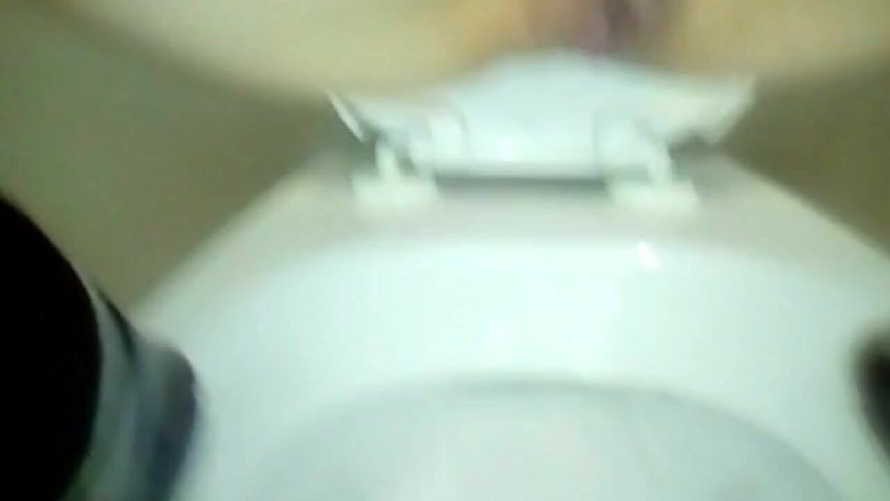Watch this kinky slut defecate in the toilet up close and personal