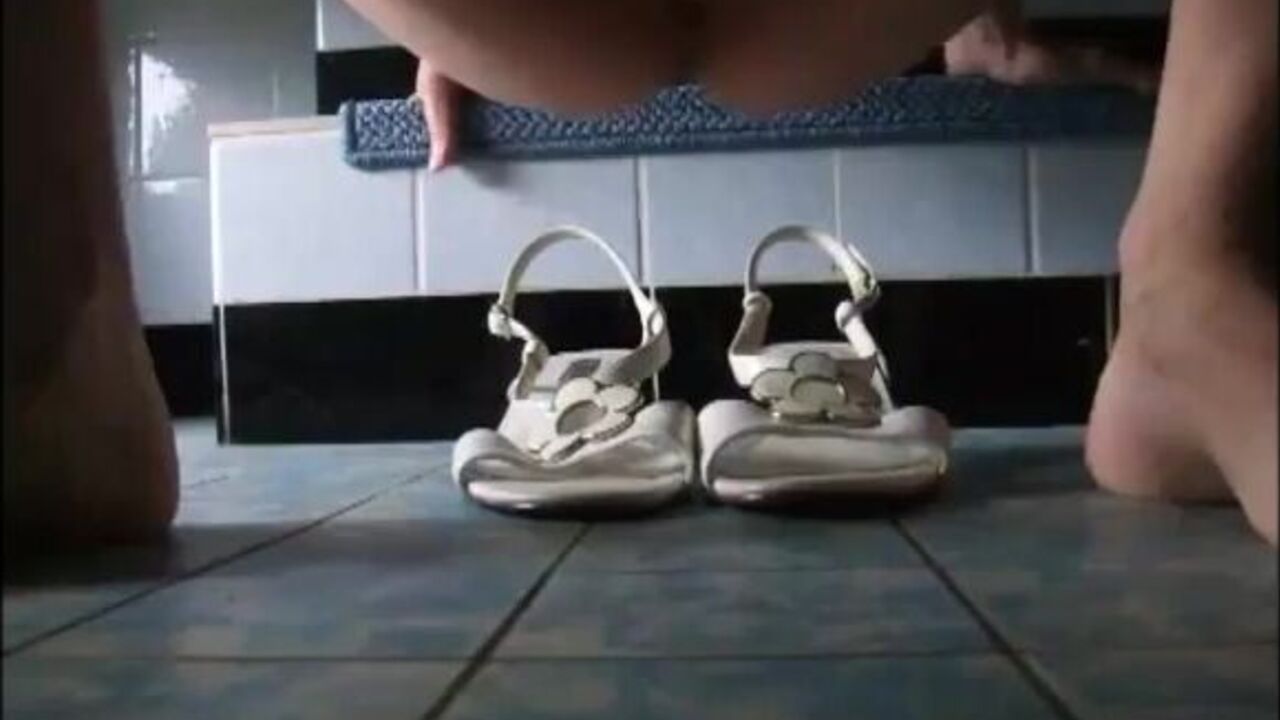 Watch this slutty girl scat on her sandals then flaunt it with pride