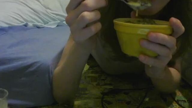 girl enjoys eating  scat custard and pudding