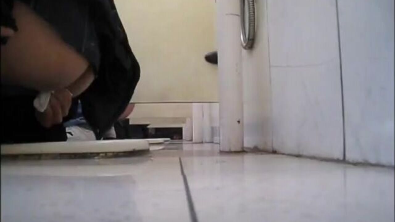 Watch this voyeuristic dude take a piss in a squat toilet