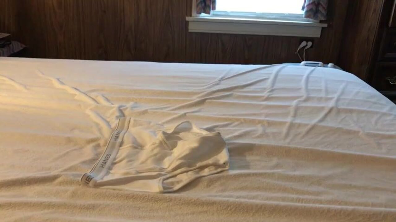 Watch as a hung dude gets drenched in his own pee and white panties