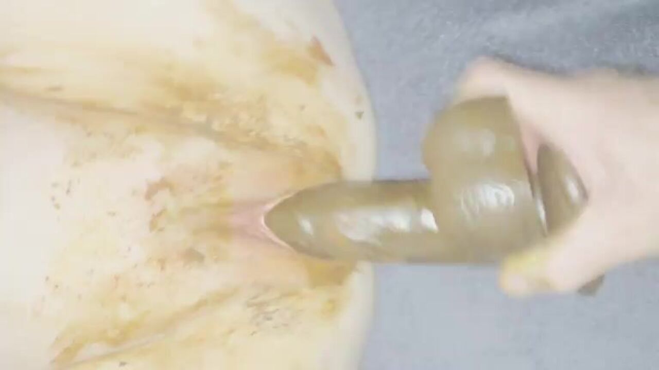 Watch this dirty slut get her scat stuffed in this scat porn video