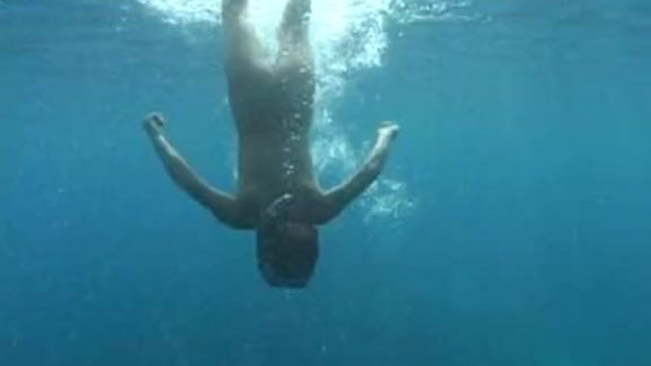 Asian girl underwater gets her ass fisted and scatted with a huge load