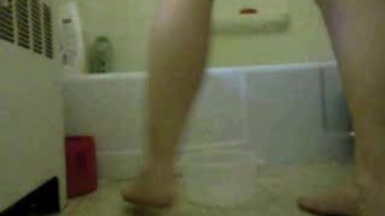 Watch this filthy slut get her pussy and ass filled with piss in the bathroom