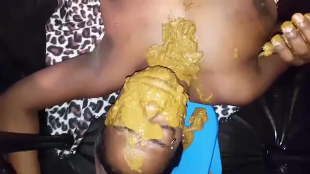Watch this submissive ebony slut get covered with scat and filthy juice