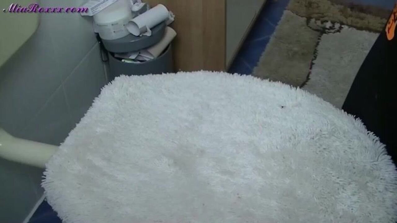 Watch Mia, the pregnant slut, get a surprise golden shower in the toilet