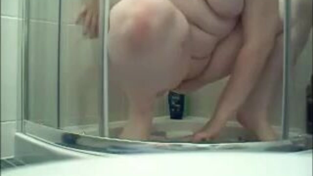 Watch this filthy girl stuff her scat and spread it all over her tits in the shower