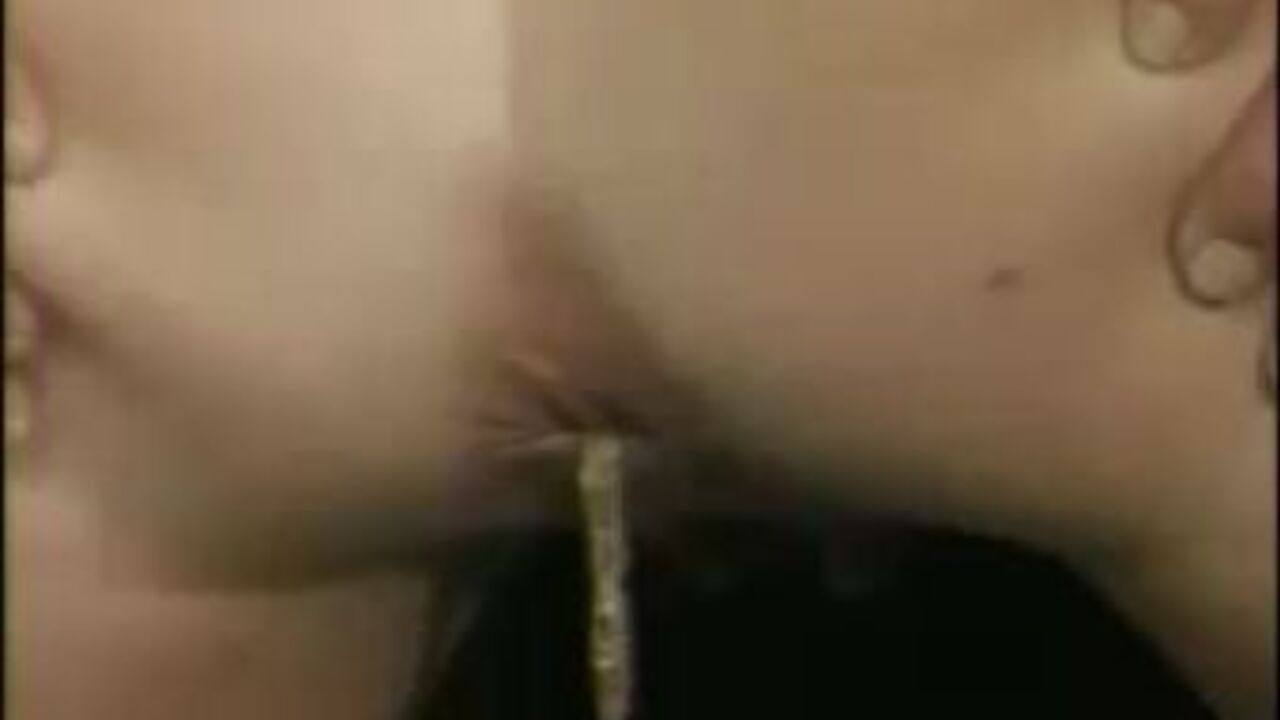 Watch this kinky chick get off on scat porn and turds