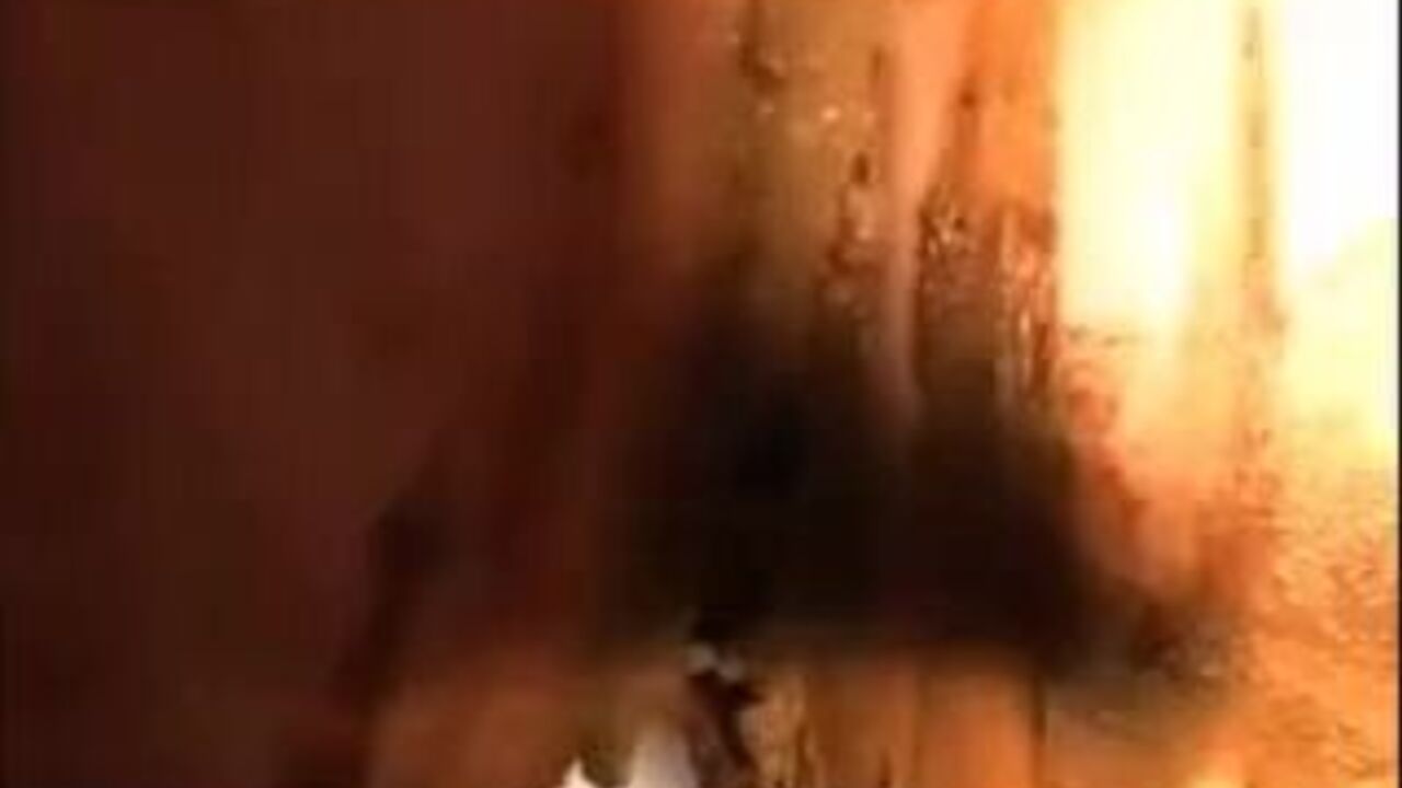 Watch this slutty woman get her ass drenched in scat and smeared with it