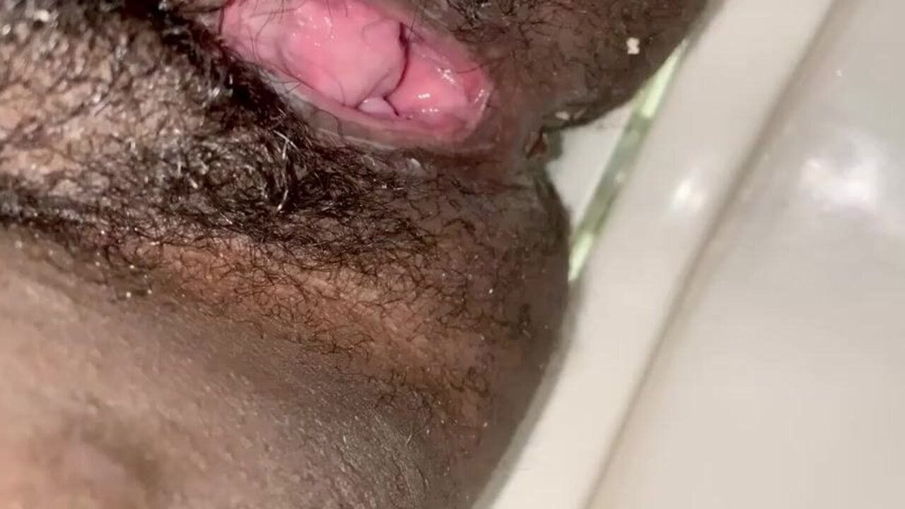 Watch this sexy ebony slut get a hot piss shower and a messy load