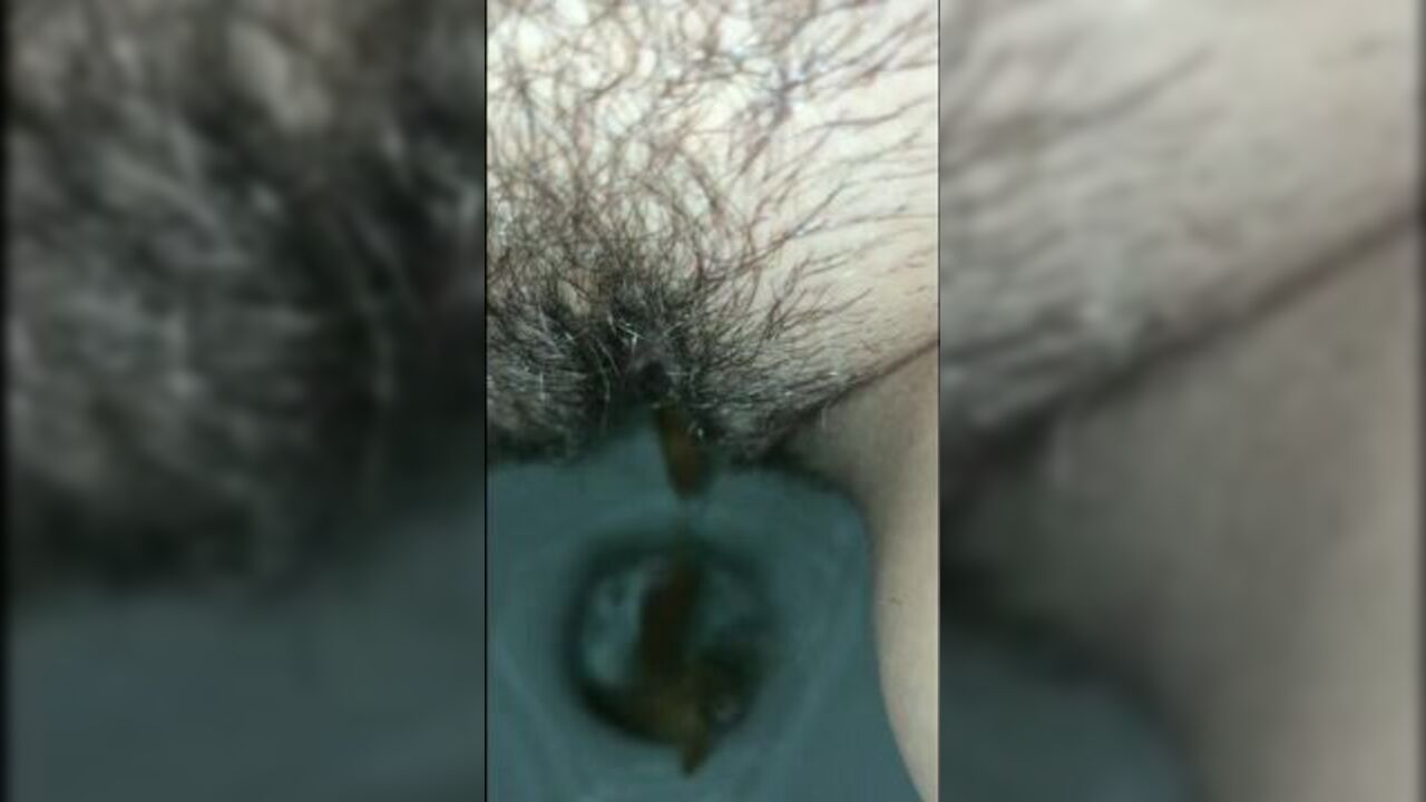 Watch this filthy slut with a hairy muff get a messy surprise