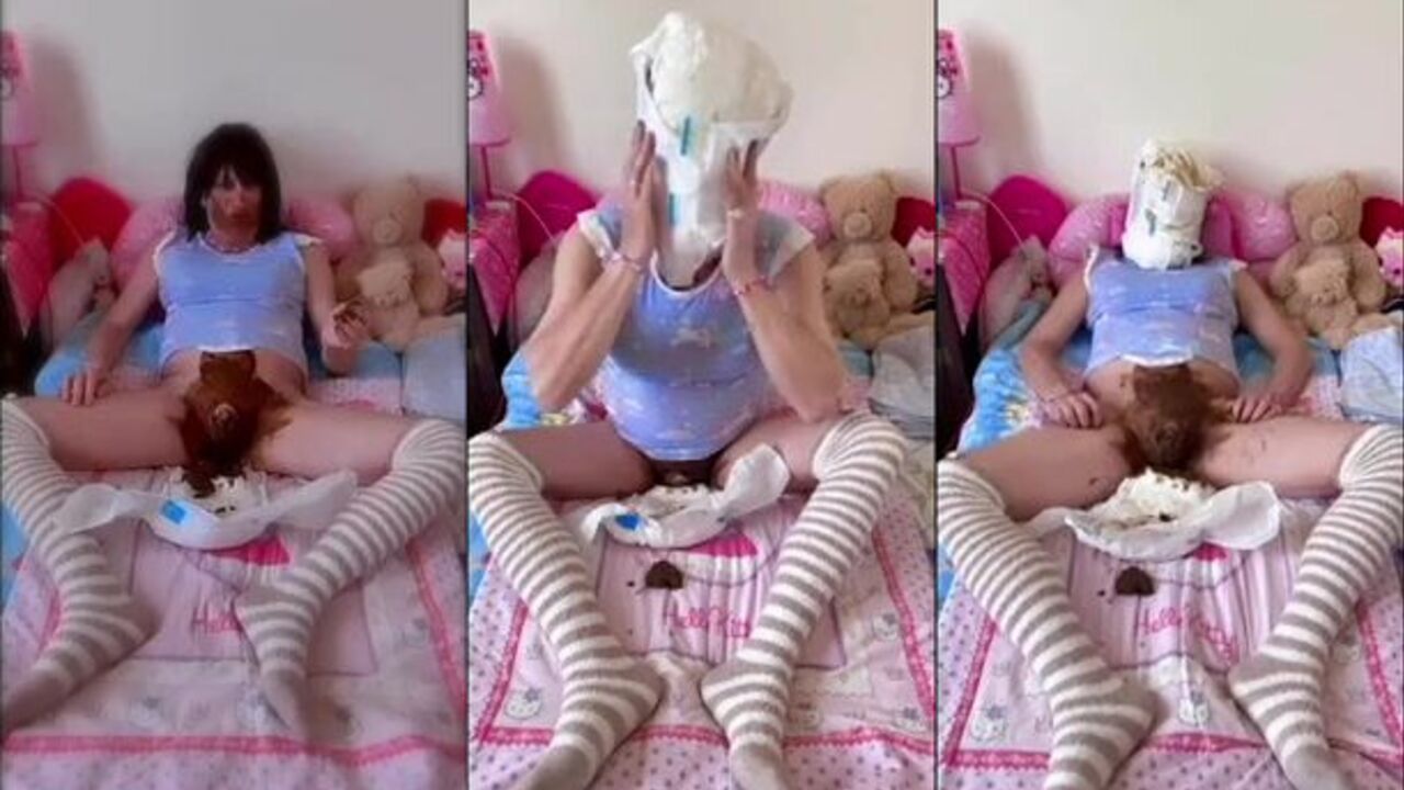 Submissive sissy gets her face smeared with poo & hood while being chained up