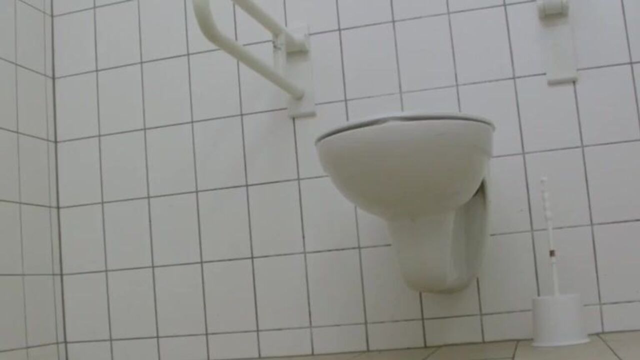 Watch this hot teen girl get drenched in diarrhea on the public bathroom floor