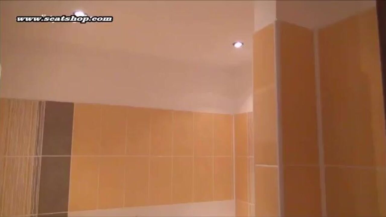 Lesbian slaves scat in the bathtub and share their kinky desires