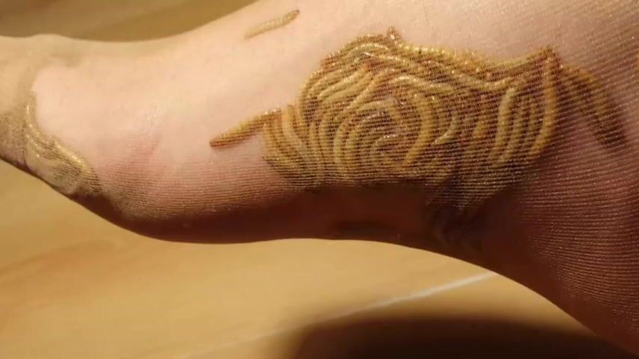 Watch this kinky babe crush maggots and tickle them for more action