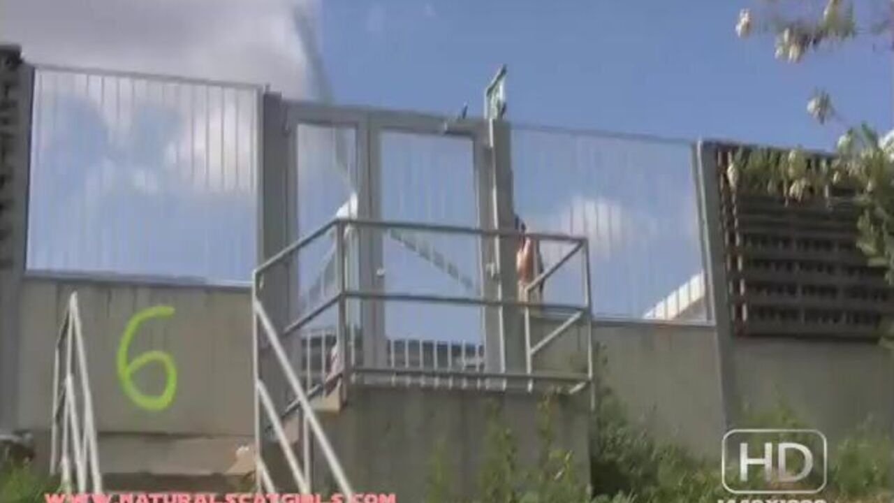 Curvy busty babe gets kinky with pissing and shitting on the stairs