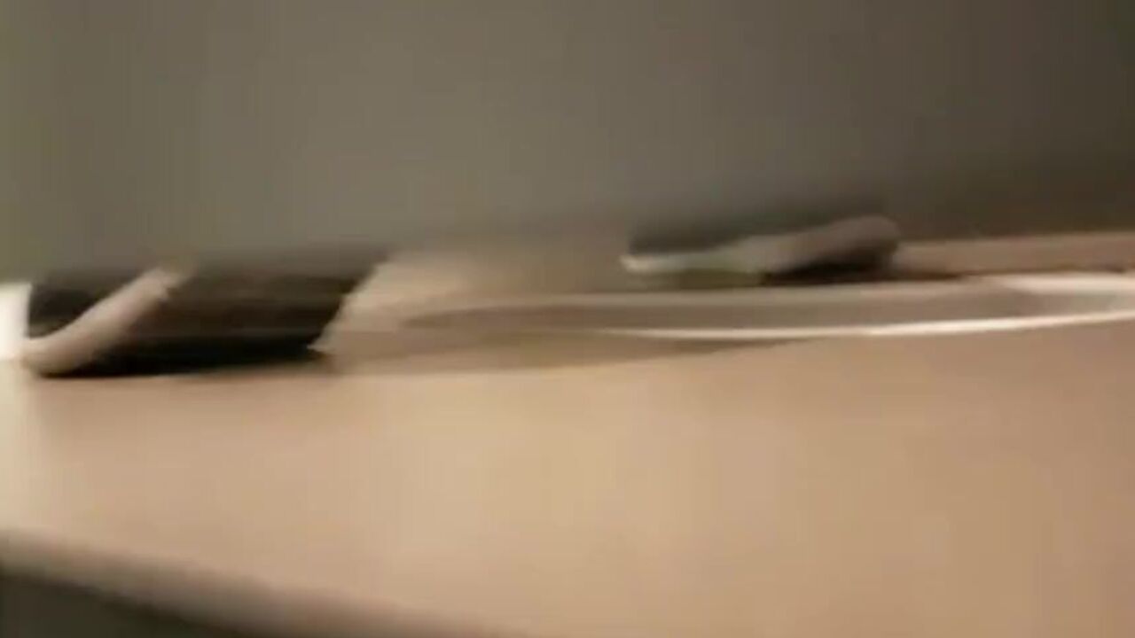 Watch as a voyeuristic guy pees in a men's toilet while others watch in awe